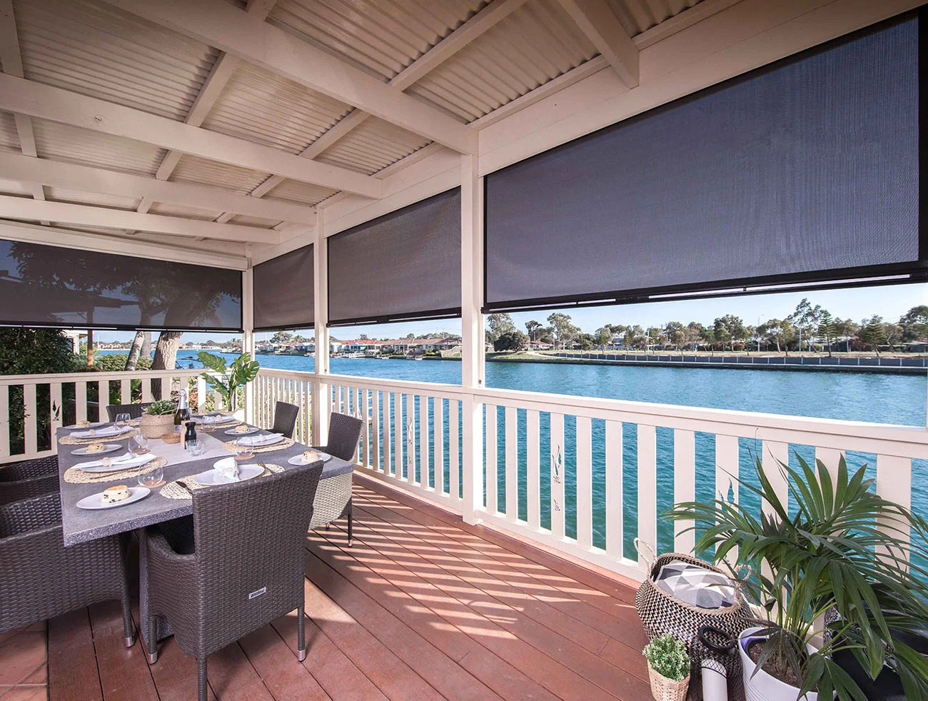 a patio with ziptrak outdoor blinds