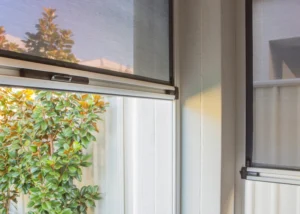 a close up of two automated outdoor blinds